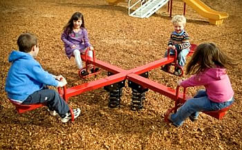 Baby Seesaws Outside on Playground with Crumbly Melting Spring